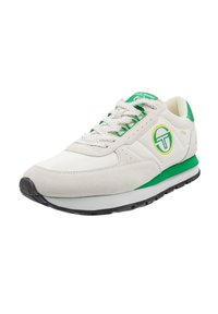 White sneaker with green accents; features suede and mesh materials, round toe, laces, padded collar, and logo detail on the side.