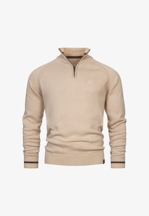 Beige zip-kraag trui met ribbelstructuur. Heeft een gestreepte afwerking bij de kraag en manchetten. Borduursel met logo op de borst.