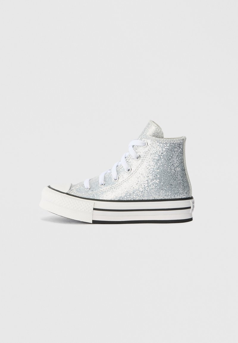 Silver high-top sneakers with glittery material, white laces, and a black and white striped sole. Features a rounded toe and solid back.