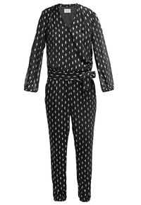 Combinaison noire à manches longues avec motif blanc en forme de feuille, haut cache-cœur col en V, ceinture à la taille et pantalon fuselé.