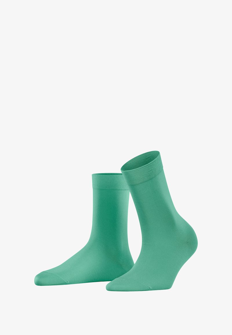 Turquoise cotton socks with a smooth texture, knee-length design, and a ribbed cuff. Features a solid color without patterns or embellishments.