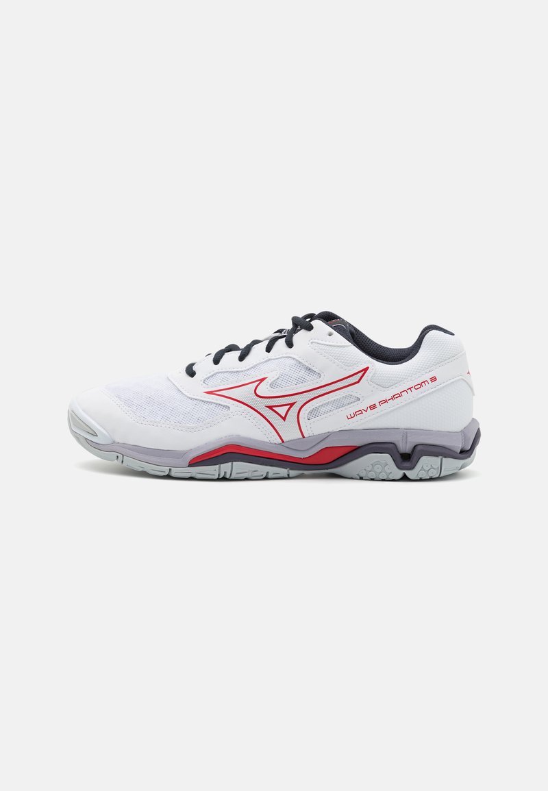 White athletic shoes with red accents. Mesh upper, padded collar, and black laces. Textured sole with gray and red detailing. Side logo visible.