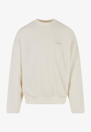 Light cream sweatshirt in a textured knit, featuring a round neckline, dropped shoulders, and ribbed hem. Subtle branding on the chest.
