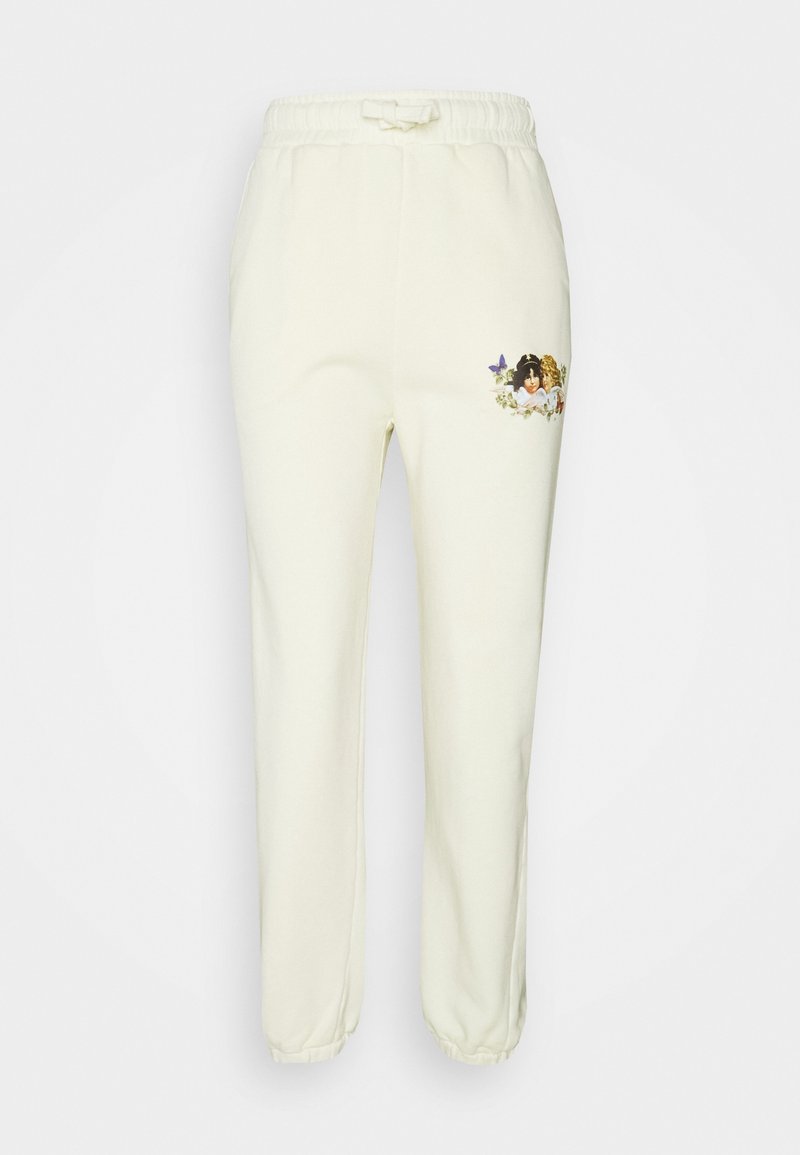 Crème-kleurige joggingbroek met een elastische tailleband, voorzien van een decoratief patroon van bloemen en kinderen op de linker bovenbeen.