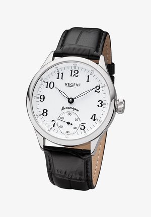 Montre analogique avec cadran blanc, chiffres arabes noirs, aiguilles des heures et des minutes noires, petit cadran des secondes, et bracelet en cuir noir.