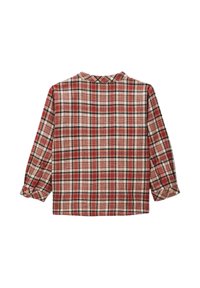 Chemise à carreaux rouge et beige avec des manches trois-quarts, des poignets à un bouton et un col. Fabriquée en tissu texturé.