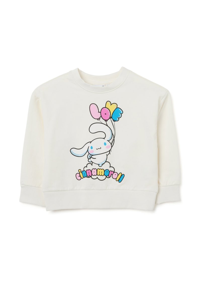 Sudadera de color crema con un dibujo de un conejo de dibujos animados sosteniendo globos coloridos y el texto "cinnamoroll" en una fuente divertida.