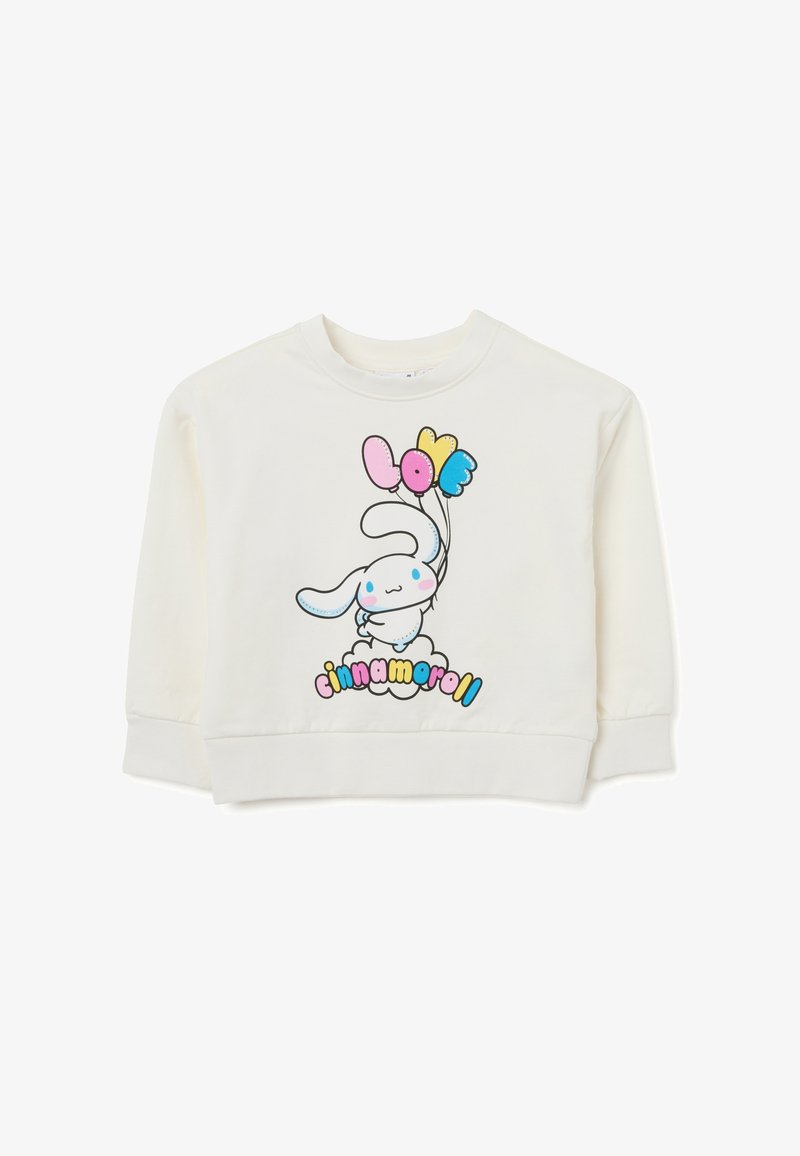 Felpa color crema con un cartone animato di un coniglio che tiene palloncini colorati e la scritta "cinnamoroll" in un font giocoso.