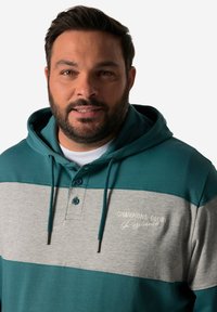 Felpa con cappuccio in teal e grigio con patta a bottoni. Caratterizzata da testo ricamato "CHAMPIONS GLORY" e cordini. Tessuto misto cotone.