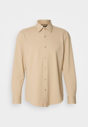 Beige long-sleeve shirt made of textured fabric with a checkered pattern, featuring a button-down front and cuffs, tailored fit.