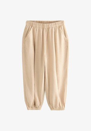 Beige Freizeithose mit elastischem Bund und Bündchen, vordere Seitentaschen, lockerer Schnitt, aus leichtem Stoff gefertigt.