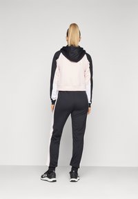 adidas Sportswear BOLDBLOCK TRACKSUIT - Tuta - black/sandy pink