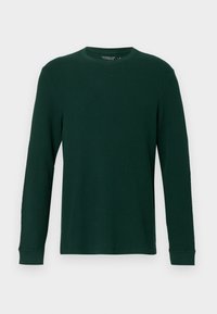 Σκούρο πράσινο πουκάμισο με μακριά μανίκια που διαθέτει απαλή υφή, στρογγυλή λαιμόκοψη και εφαρμοστά μανίκια. Απλός σχεδιασμός χωρίς ορατά μοτίβα ή λεπτομέρειες.