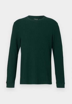 Maglietta a maniche lunghe di colore verde scuro con texture a coste, colletto rotondo e polsini aderenti. Design semplice senza motivi o accenti visibili.