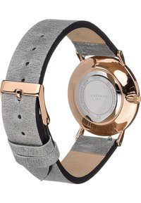 Runde Uhr mit einem Gehäuse aus roségoldfarbenem Metall, grauem Lederarmband und minimalistischer Gestaltung. Die Rückseite besteht aus Edelstahl und ist wasserdicht.