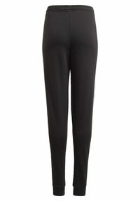 Pantalones de chándal negros hechos de tela suave, con un ajuste tapered, cintura elástica y puños acanalados en los tobillos. Diseño liso, sin patrones.