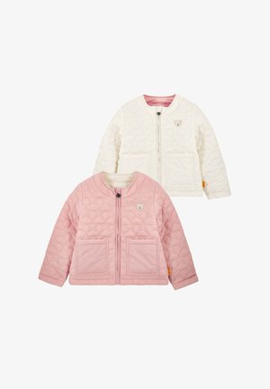 Two quilted children's jackets, one pink and one cream, both with front pockets, zipper closures, and a small teddy bear logo on the chest.