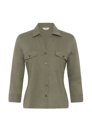 Olive roheline naiste särk, millel on pikad varrukad, nööbitav eesmine osa, kaks nööbitavat rinnataskut ja terav krae.