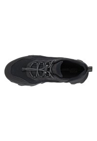Black athletic shoe with a mesh upper, textured surface, reinforced toe, adjustable laces, and a contrasting pull tab at the heel.