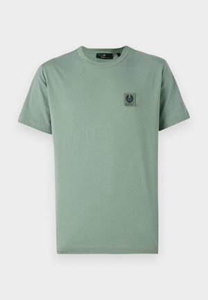 Light green cotton t-shirt with short sleeves, crew neckline, and a square logo patch on the left chest. Smooth texture and casual design.