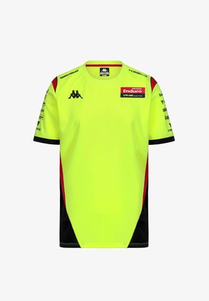 Maillot de course jaune vif avec des accents noirs et rouges, comportant plusieurs logos de sponsors, notamment Kappa et Pertamina Enduro VR46.