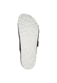 Sole di scarpa nera con fondo in gomma bianca texturizzata caratterizzata da un motivo a ciottoli e un contorno curvato.
