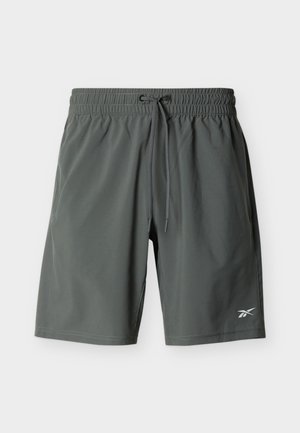 Shorts de sport gris foncé jusqu'aux genoux avec taille élastique, cordon de serrage, poches latérales et petit logo blanc sur la jambe gauche.