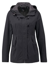 Czarna kurtka z kapturem, dwoma przednimi kieszeniami i zapięciem na guziki. Wewnętrzna podszewka pokryta jest białymi kropkami na ciemnym tle.