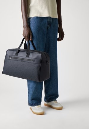 MONOGRAM DUFFLE - Geantă de voiaj mică - black