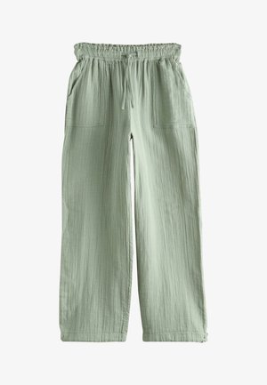 Light green wide-leg pants with elastic waistband, drawstring tie, and two front patch pockets, made of textured fabric.