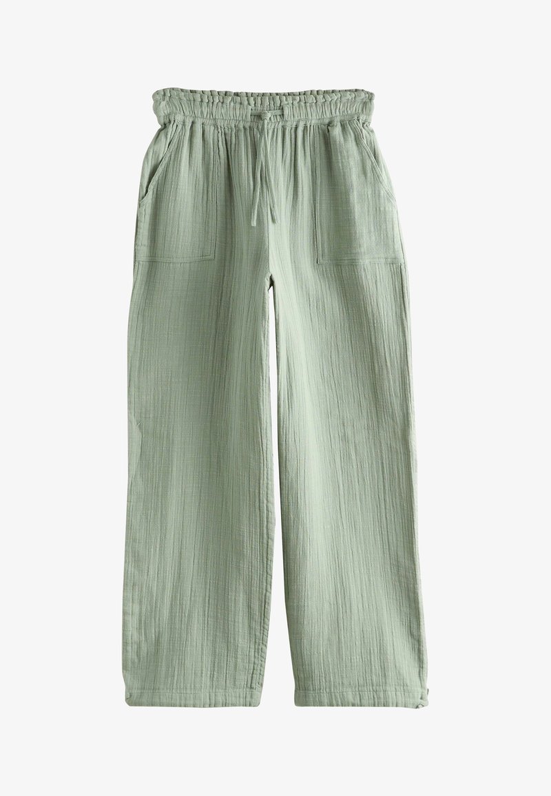 Pantalon large vert clair avec taille élastique, cordon de serrage et deux poches plaquées à l'avant, en tissu texturé.