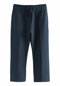 Pantalons de survêtement bleu marine avec une taille élastique, un cordon de serrage et des détails en panneaux latéraux. Fabriqués dans un tissu doux avec une texture lisse et une coupe au niveau de la cheville.