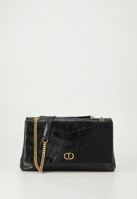 Black leather handbag with a textured, quilted pattern. Features a gold chain strap and logo accent. Rectangular shape, zip closure.