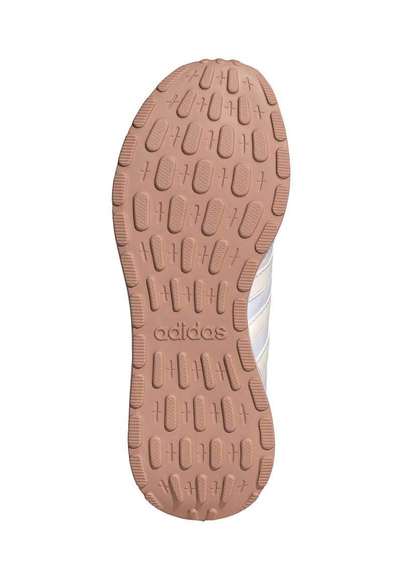 Suela de goma marrón con patrón de agarre texturizado; presenta el logotipo "adidas" en relieve; diseñada para tracción y durabilidad.