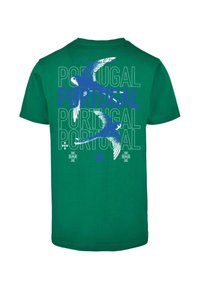 Green cotton T-shirt with a blue graphic of a bird and repeated text "PORTUGAL." Features short sleeves and a crew neckline.