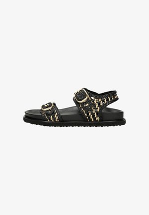 Black woven sandals with beige accents, featuring two buckled straps, a contoured black sole, and a textured woven upper.