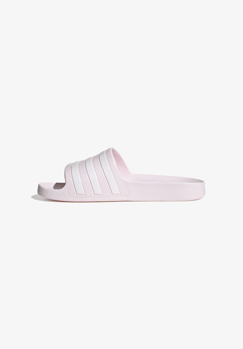 Light pink slide sandal with a textured surface, featuring three white horizontal stripes on the upper band and a flat sole.
