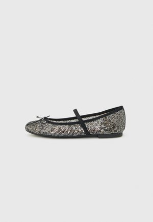 Black ballet flat with silver sequins, side strap, and small bow detail on toe, flat sole against gray background.
