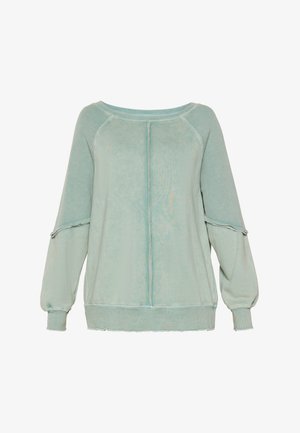 Sweatshirt ample vert clair avec texture côtelée, encolure large et manches volumineuses. Présente un ourlet brut et des détails de couture sur le devant.