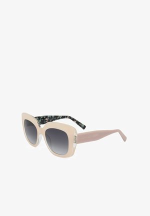 Occhiali da sole quadrati oversize beige con lenti grigie sfumate e aste interne con motivo floreale, mostrati su sfondo bianco.
