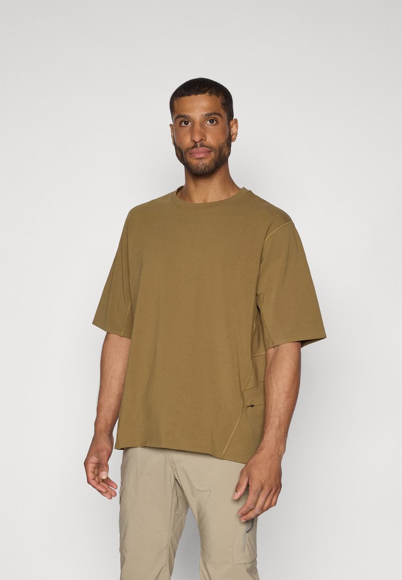 Olive green short-sleeve t-shirt with a relaxed fit, featuring a crew neckline and a side seam detail. Soft, lightweight fabric.
