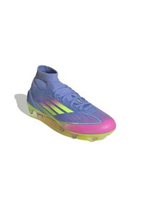 Light blue soccer cleat with a high-top design, gradient pink to yellow sole, and three bold yellow stripes on the side. Textured surface details.