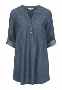Dunkelblaue Denim-Tunika mit V-Ausschnitt, drei Knöpfen an der Vorderseite, hochgekrempelten Ärmeln und zwei Seitentaschen. Weiche Textur.