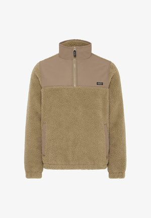 Kerge pruun fliispusa, millel on veerand-zipper, kõrge krae ja kontrastne sile ülemine rindkere paneel, millel on väike must silt.