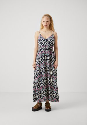 Robe maxi en marine avec un motif floral, présentant des bretelles spaghetti, une taille cintrée et des franges décoratives à l'ourlet.