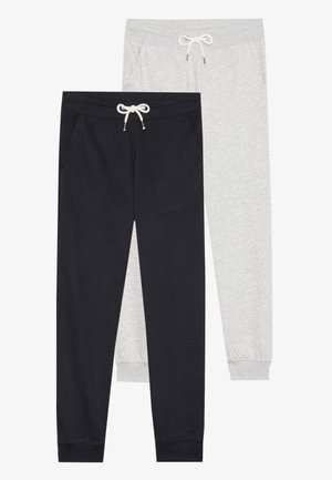 Two pairs of sweatpants: one black and one light gray. Both feature elastic waistbands with drawstrings and side pockets. Cotton blend fabric.