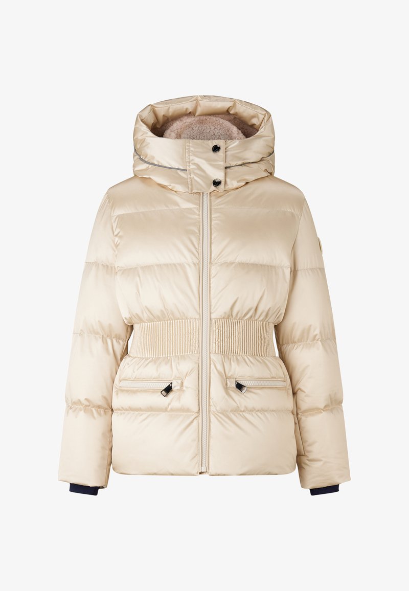 Beige puffer jacket with a high collar, ribbed waistband, double front pockets, and black zipper hardware. Features a quilted design and soft lining.