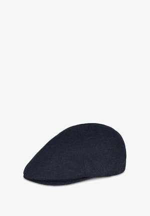 Granatowa czapka typu flat cap wykonana z teksturowanej tkaniny, o zaokrąglonym kształcie, z przeszytymi detalami na szwie i gładką podszewką wewnętrzną.