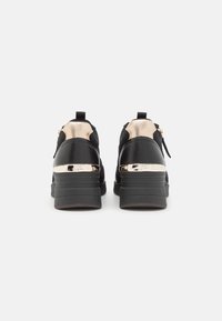 Tamaris Zapatillas - black/gold