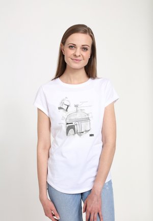 T-shirt en coton blanc avec un design graphique d'un casque et d'une structure en dôme dans des tons noirs et gris. Manches courtes, col ras du cou.